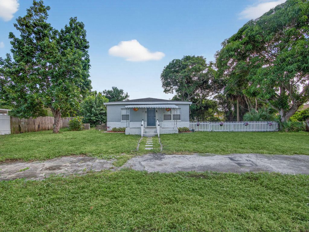 Photo of 1373 W 35th Street, Riviera Beach, FL 33404 (MLS # R11140063)