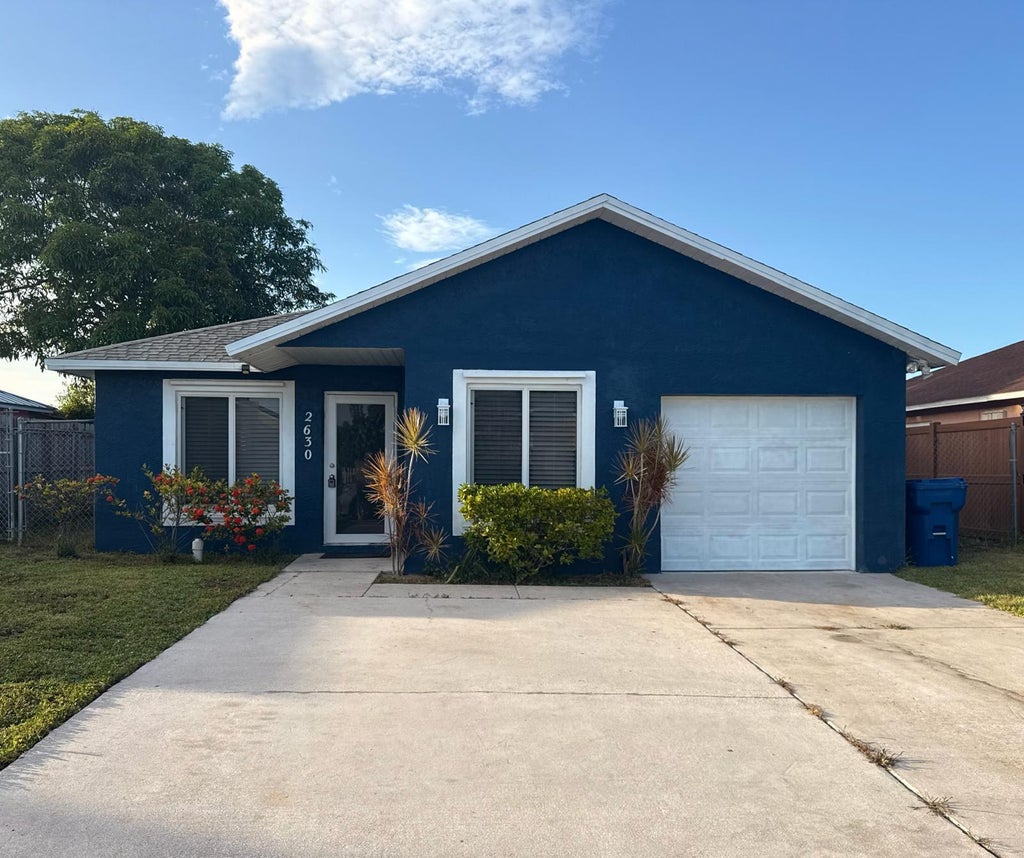 Photo of 2630 W 28th Street, Riviera Beach, FL 33404 (MLS # B26046728)