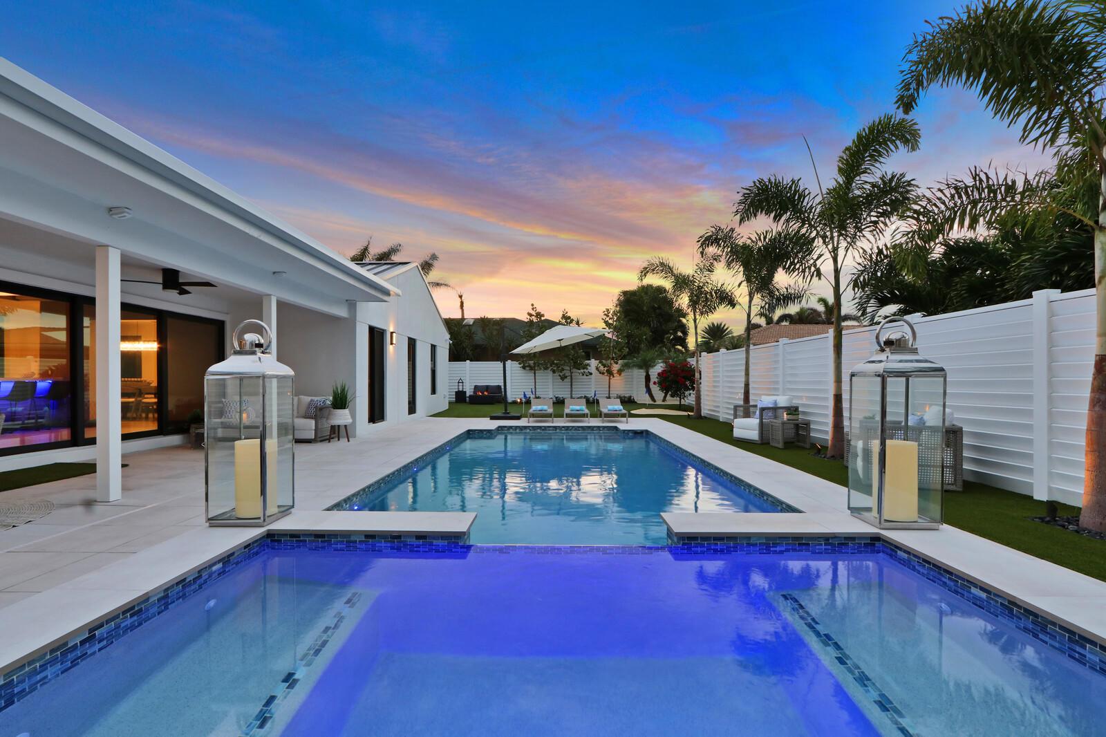 Welcome to your seaside retreat. Enjoy this professionally designed and decorated beachside paradise bringing the Northwest feel to the Juno seaside,.There is not a detail missed in this luxurious home.Sleeps 14, dining for 20. Restoration Hardware inspired decor throughout including furnishings, Italian imported porcelain concrete look flooring, and kitchen and bath appointments.The spacious and bright double living area is conducive to large gatherings featuring a double sided fireplace, entry wet bar and two separate bar top dining areas.. Entertainment room with 86'' tv and foosball table opens out into the fabulous covered outdoor living space. Kitchen features Thermadore Integrated appliances, quartz counter tops, ample custom cabinetry,printer/charger bar work station,built-in oven