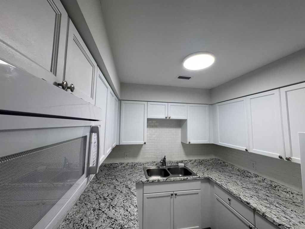 Photo of 243 Castelwood Drive #5, North Palm Beach, FL 33408 (MLS # R11064130)