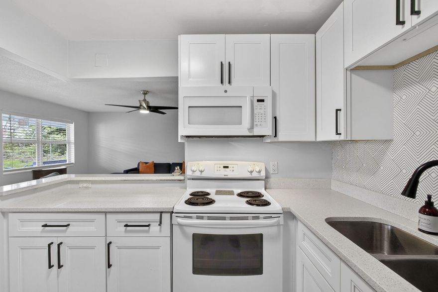 LOOK NO FURTHER-THIS IS IT YOUR BEAUTIFULLY UPDATED SECOND FLOOR 2 BEDROOM 1.5 BATH HOME OFFERS ALIGHT, BRIGHT AND MODERN FEEL THROUGHOUT.  FEATURING A SLEEK OPEN-CONCEPT KITCHEN WITH DOUBLE SINK, MICROWAVE AND DISHWASHER.  THIS HOME IS PERFECT FOR COMFORTABLE EVERYDAY LIVING AND ENTERTAINING.  BOTH BATHROOMS ARE UPDATED- ONE WITH STEP IN SHOWER. ENJOY PEACE OF MIND CENTRAL AIR (2YEARS OLD) HOT WATER TANK (3 YEARS OLD) AND HURRICANE IMPACT WINDOWS..  NESTLED IN A GREAT ASSOCIATION WITH BEAUTIFUL LANDSCAPING AND A RELAXING PATIO  TO SIT OUT ON AND ENJOY THE FLORIDA WEATHER. PLUS IT'S IN A QUIET AREA BUT VERY CLOSE TO THE OKEECHOBEE GATE.  COME & ENJOY RESORT STYLE LIVING IN THIS GATED COMMUNITY FOR ADULTS 55 +. CLUBHOUSE features a theater, indoor pool, card room, community/party room, bill CLUBHOUSE features a theater, indoor pool, card room, community/party room, billiard room ,shuffle board ,tennis , pickqleball ,bocce and two outdoor pools. Numerous heated outdoor pools throughout the community. Separate fitness center with gym , outdoor heated pool and a resistance pool. Two guarded gates and 24 hour roving security patrol. GREAT LOCATION: close to shops, restaurants, PBI airport and beaches.