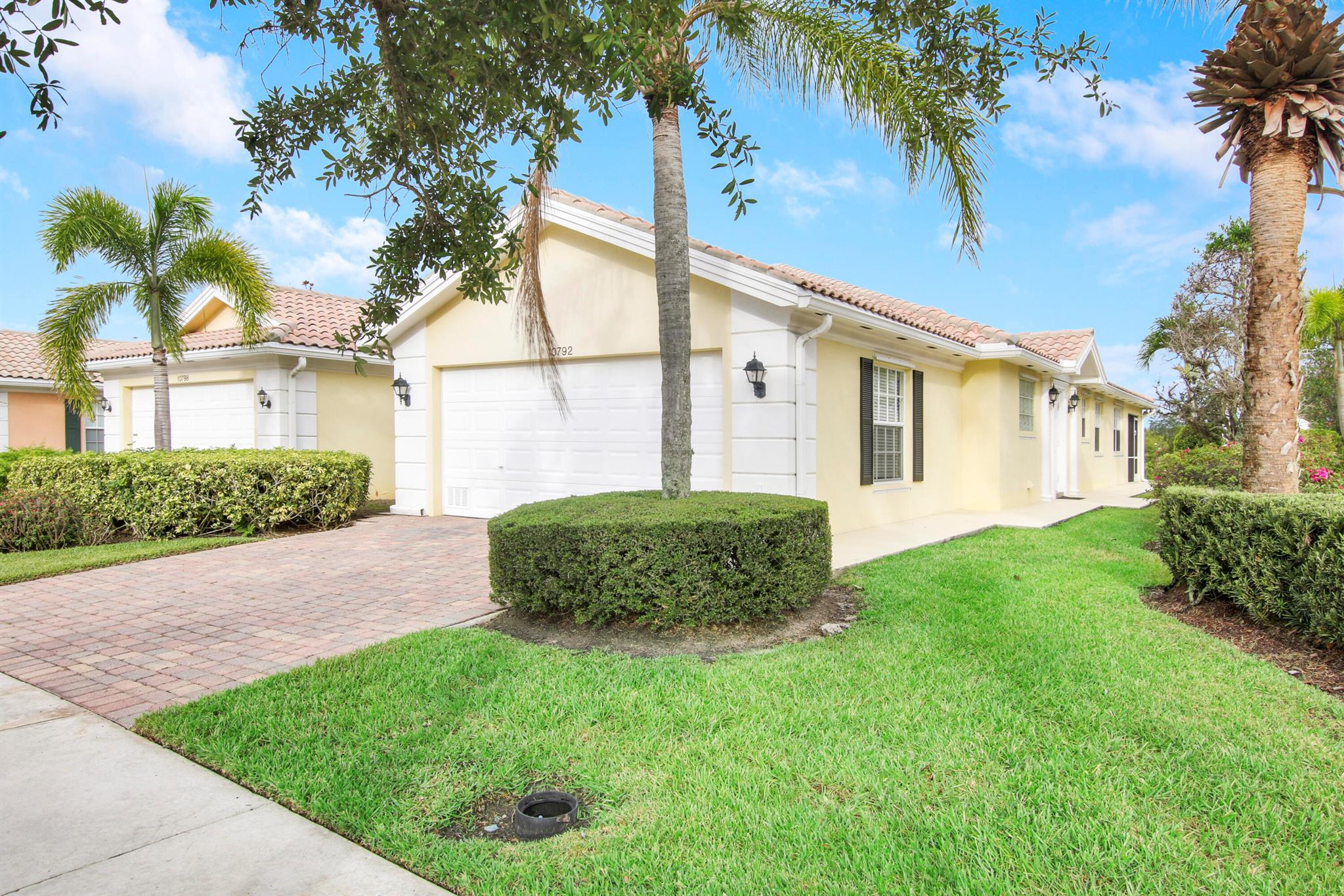 Need a rental for the summer/fall? Look no further! This fully furnished/turnkey 2BR/2BA villa in the heart of Tradition is available for rent starting May of 2023. Recently upgraded with beautiful wood-look tile flooring t/o, new baseboards, new furnishings, dish ware and patio furniture! Just bring your toothbrush and settle right in. The two bedrooms each have their own bathrooms and can be used as double master suites. Spacious laundry room with utility sink, an abundance of cabinetry and counter space for folding. Screened and covered back patio overlooks the back yard and is a great spot to enjoy Florida sunsets. Landlords will consider pets on a pet-by-pet basis. Rent includes cable, internet, lawn care and garbage. Located walking distance to Tradition square. Call today to view!