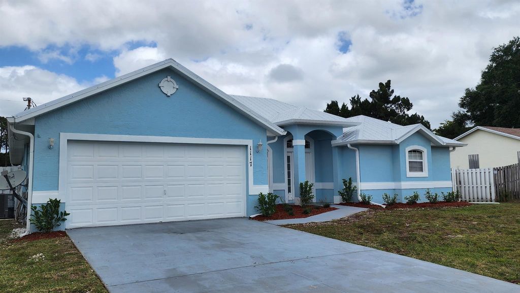 Photo of 1117 SW Sudder Avenue, Port Saint Lucie, FL 34953 (MLS # R11052494)