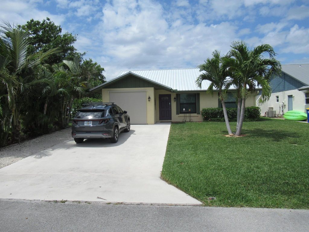 Photo of 5832 SE Collins Avenue, Stuart, FL 34997 (MLS # R11084708)