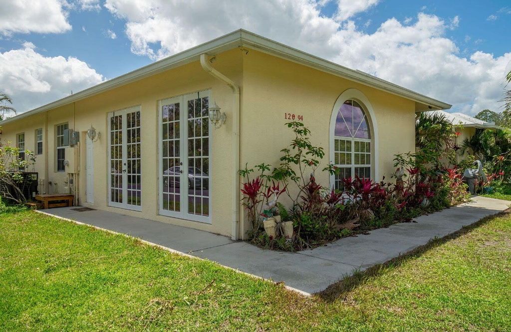 Photo of 12094 Citrus Grove Boulevard, West Palm Beach, FL 33412 (MLS # B26028238)