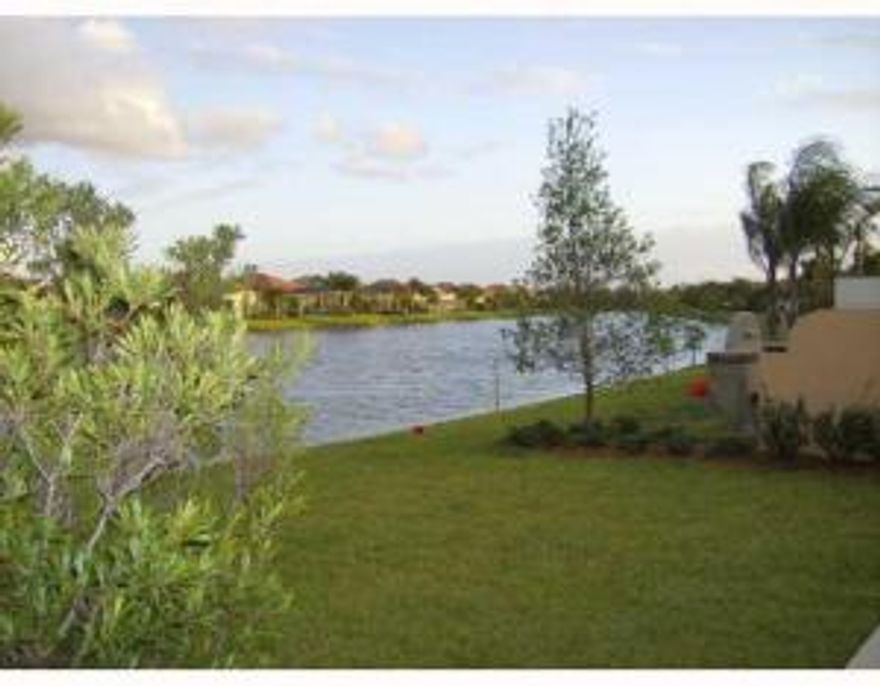 Beautiful villa on lake with Builder enclosed French doors den area.  Tile, wood, corian countertops, stainless steel appliances, central vac system and private garden setting in the back with tranquil lake views. 2 bedrooms, plus den, 2 bathrooms and 2 car garage. Association permits pickup trucks but they must be kept inside garage.