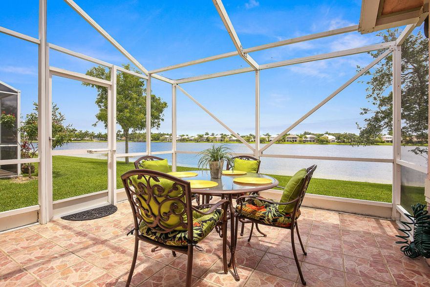 Simply beautiful describes this lovely lakefront villa best. Quality finishes throughout including crown molding, decorative wall moldings, a custom built-in, closet organizers, beautiful window treatments, quality wood cabinetry, beautiful granite counter tops and vanities... The air conditioner is newer. The view is one of a kind and can be seen from almost every room... The screened and tiled patio provides the ideal outdoor living space...  Wellington's Edge is a highly sought after gated community with an ideal location. Only minutes to the Wellington Green Mall, world class equestrian venues, A-rated Wellington schools, Whole Foods, Trader Joe's, Fresh Market, restaurants, hospital and more. Amenities include a clubhouse, fitness center, tennis courts, 3 community pools, a guard gated entrance, many lakes and nature preserves... Hurry!!! This beautiful home will sell quickly.