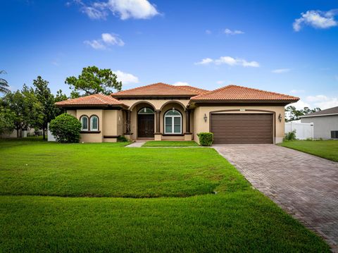 Photo of 6009 NW Wolverine Road, Port Saint Lucie, FL 34986 (MLS # R11125764)