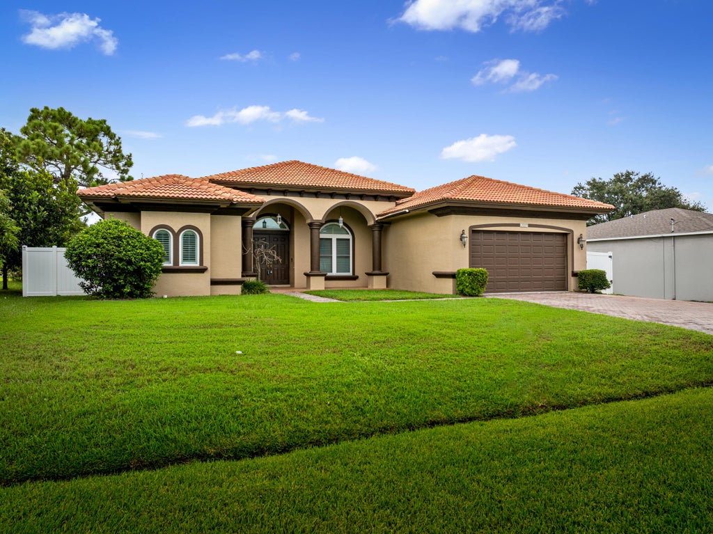 Photo of 6009 NW Wolverine Road, Port Saint Lucie, FL 34986 (MLS # R11125764)