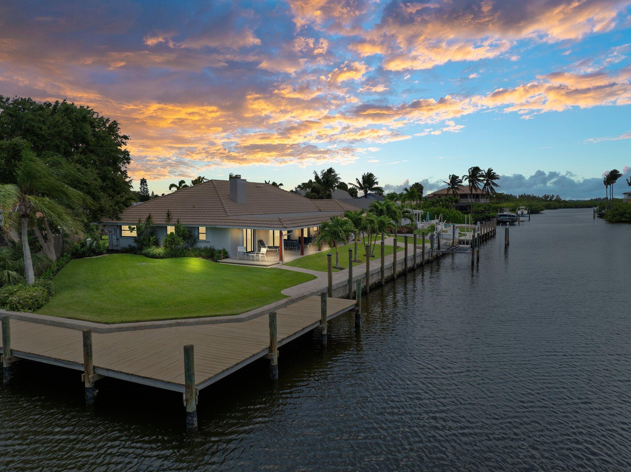 Bring your big boat and stay for the season in style! Located in the highly sought-after Queens Cove neighborhood, this furnished seasonal waterfront rental offers deep-water access and ample dock space for a large vessel. Just a short cruise to the area's premier inlet--considered among the best on the East Coast--you'll enjoy world-class ocean and river fishing right at your fingertips. Dates are flexible. Bask in private deeded beach access, or explore county park beaches with tennis and pickleball courts. Minutes away is the Navy SEAL Museum and all the coastal lifestyle you could ask for. Come with your big boat and make this waterfront paradise your home away from home!