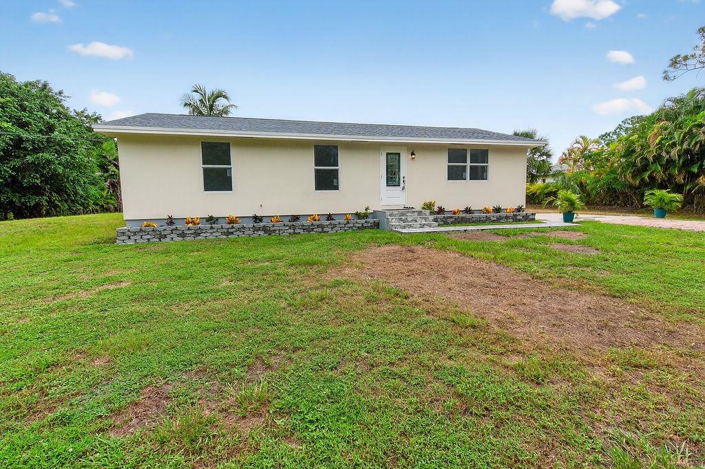 Completely Renovated Jupiter Farms Home - No HOA, 1.25 Acres This beautifully renovated 3 bedroom, 2 bathroom home sits on a spacious 1.25 acre. Every detail has been thoughtfully curated, making it move-in ready. 2024 Roof, freshly painted in & out, exquisite new pavers at all entrances, New AC & Water Heater, New Impact Glass Windows & doors, Sophisticated Open concept Kitchen boasts custom Center Island, new Frigidaire appliances. Elegant living spaces, Modern Finishes & elegant bathrooms showcasing refined tile and marble. Tile and Porcelain Flooring throughout. GE washer & dryer. Located on a paved road, Top rated schools, 5 miles to I-95 & Florida Turnpike. This home combines modern upgrades with country style living, all within minutes of everything Jupiter has to offer.