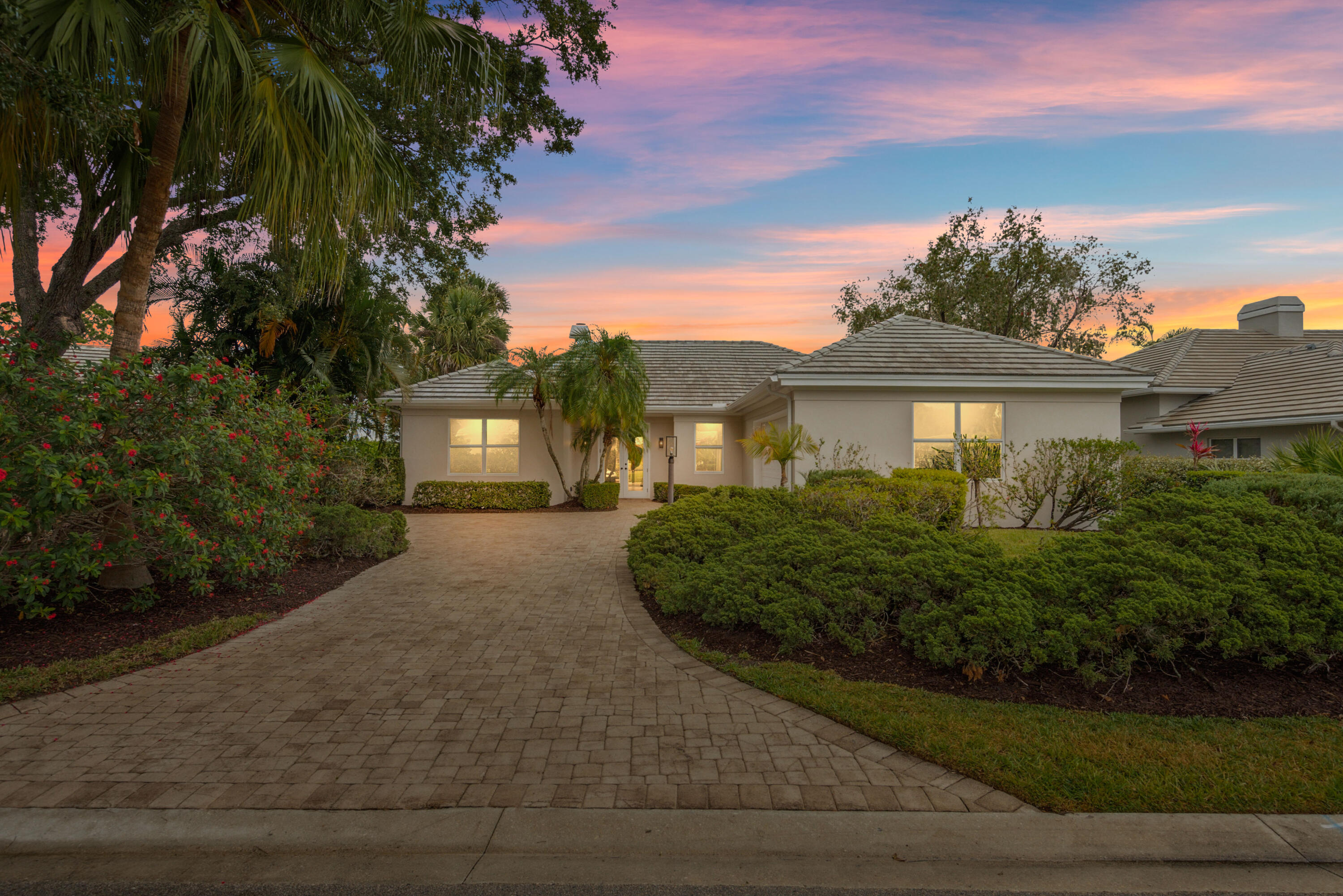 Live where luxury meets lifestyle in the heart of South Florida! Enjoy this FULLY updated, waterfront, and move in ready 3BR/2.5BA home in the prestigious PGA Village. Every detail has been thoughtfully updated--BRAND NEW ROOF, BRAND NEW IMPACT windows and sliding doors, designer kitchen, custom bathrooms, new flooring, lighting, and premium Samsung appliances! No expense spared and not a single detail overlooked; this home is truly turnkey. Enjoy stunning golf course and lake views from your expansive master suite, as well as a private backyard spa, and an oversized two-car garage with additional parking. This is a rare opportunity in South Florida for luxury living in Port Saint Lucie's most desirable neighborhood.