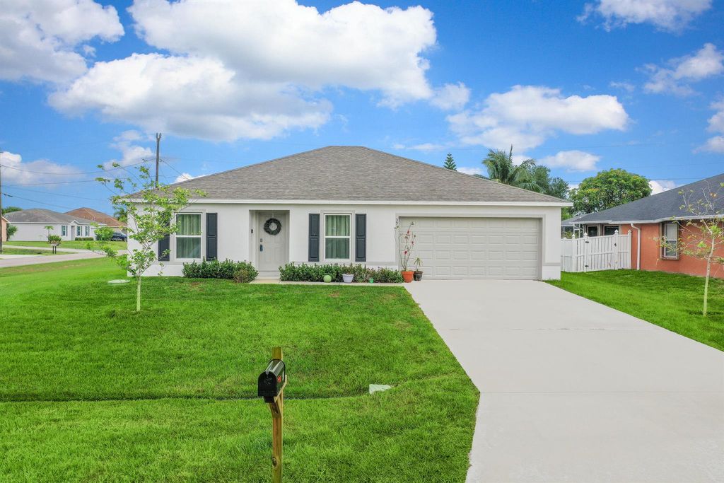 Photo of 591 SW Halifax Avenue, Port Saint Lucie, FL 34953 (MLS # R11090099)