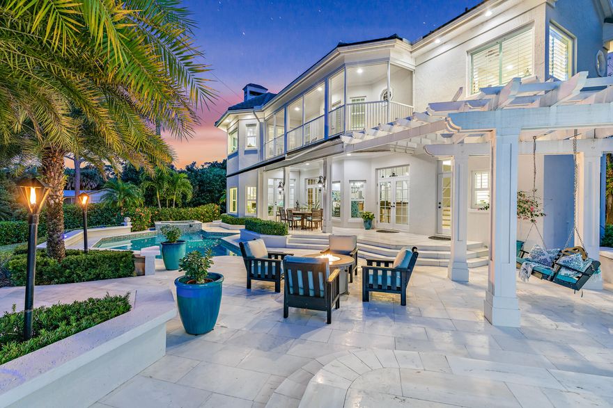 If you're thinking ''WHOA, can this property be REAL?'', we have great news for you -- It IS real, and it is available now, just in time for Spring 2021! 8319 SE Rivers Edge is one of Jupiter's finest waterfront properties. Comprised of two spectacular residences - the 5,500 sq ft main home and 2,000 sq ft guest house - on one magnificent, sprawling 2.3 acre fully fenced & gated private property. ''Riverdance'' (as affectionately called by the original builder) was inspired by design elements found in coastal Virginia and along the Carolina coastline, and has everything you would want in your perfect home in the Palm Beaches. 

Riverdance features two full residences on one unique, sprawling property -- the 5,500+ sq ft main house and the 2,000+ sq ft carriage house and [Click to Read Mo enough garage space to hold 10+ cars between the main home and carriage house. Additional exterior features on the property include a sparkling pool & spa with new pool pump & heater, and spectacular marble pool deck and patio, retractable awning, fire pit, gas tiki torches, 115 ft of manicured waterfront with 270 degrees of privacy and views, a freshly painted (premium non-slip & durable coating with 10 year warranty) dock with electric and water, a covered 16,000 lb boat lift (YES! Covered boat lift is allowed in Jupiter! Lift currently holds a beautiful 32 ft Whaler "Vantage" - also for sale - contact listing team for more information), a brand new floating kayak dock, outdoor summer kitchen with new Lynx grill, and enough room to add a tennis court!  The exterior features at this property are truly endless - the current owner has cared for the home meticulously and has all kinds of fun additions throughout the property including reciprocals for holiday lights, magnificent landscape uplighting, hot water spigots for washing cars, and dozens of other features. 

MAIN HOUSE:  The main house is a masterpiece of both design and function, featuring an elegantly open floor plan with both formal and casual living spaces, exquisite designer finishes reminiscent of Coastal Virginia and the Carolinas, but with a distinctive Palm Beach flair, curated by an acclaimed local designer. The home is being offered fully furnished, although it can be purchased unfurnished. 

Renovated in 2018, this home has been meticulously cared for, with pride of ownership felt throughout the home from the moment you pull up to the elegant gate, and wind down the property's magnificent tree lined driveway.  

The Main House was designed with the entertainer in mind with a spectacular gourmet chef's kitchen (gas range!), and large butler's pantry / service kitchen anchoring the main living space featuring double ovens, double dishwashers, plate & bread warmer, double refrigerators, double freezers, double sinks, a water filtration system, trash compactor, and walk-in pantry.  
The kitchen's woodwork and millwork are a work of art and is perfectly contrasted by the home's freshly painted crisp, white trim and walls. 

Four large bedrooms can be found upstairs (one currently setup as the second office) - all with generous sized closets, high ceilings, spectacular natural lighting, and waterfront views for days.  The master bedroom is a masterpiece in itself with a huge en-suite sitting room (could be a queen's closet!), wetbar, and his & hers closets. 
Other luxuries in the Main House include TWO laundry rooms - one upstairs and one downstairs making the South Florida lifestyle effortless, a walk-in wine "cellar", and fireplace & mantel in the Florida Room / sitting room overlooking Loxahatchee's peaceful waterfront. 

CARRIAGE HOUSE
The Guest House (or "Carriage House") is a two-level, 2,000+ square foot, three bedroom home, with a HUGE garage space underneath and an ADORABLE living space on the second floor. With three bedrooms, including a master suite, an open floorplan, new kitchen (hello butcher block countertop!), designer lighting, and the ceiling beams from your DREAMS, this guest house is the icing on the cake of this picture perfect property. 

Privacy, luxury, and elegance are all words that come to mind when thinking about Riverdance.  Come see this magnificent home today before it is too late!