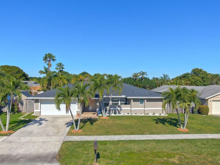 Amazing 4 bedrooms, 2 bath 2 car garage pool home with upgraded kitchen , granite counters, tile and wood flooring thru out. NO HOA,  Roof is only 1 year old. All doors even the garage door is impact windows. New upgraded garage door and all openers. seamless gutters, resurfaced pool, color changing lights in pool. Salt water system, t4ravertine deck, freshly painted inside and out. sprinklers system. 5 ton air conditioning system less than 5 years old.