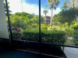 Spacious, clean, and TURNKEY move-in ready! This bright first-floor LARGE 1-bedroom, 2-bathroom unit features a walk-out patio that opens directly to a lush, tropical garden in the highly desirable South Gate community. Enjoy serene views of the peaceful lagoon that winds through the property and take advantage of easy beach access just across the street.Convenient in-unit washer and dryer. Tenant pays electric only.Don't miss this tropical retreat--schedule your showing today!