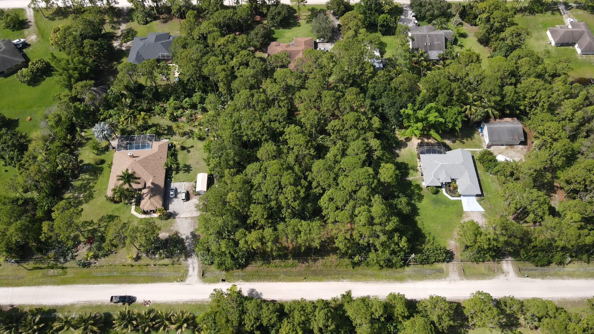 Come build your Future Home on this 1.15 acres located in The Acreage. High and Dry with lots of Pine Trees. No HOA, Horses welcome and all your toys! Close to A rated Schools