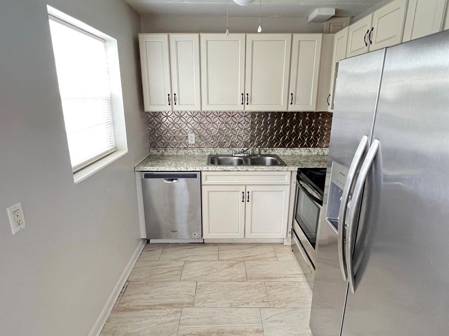 55+ Gated Community. Features a turn key updated condo situated on the first floor corner unit with stainless steel appliances, extremely bright and airy unit, freshly painted, lots of storage, walk in closet, screened in porch with central air. Immaculate. Century Village has many amenities to offer. Club house with 1200 seat theater for shows and movies, indoor and outdoor heated pools. Tennis, pickleball, shuffleboard and bocce courts. Health and fitness center, courtesy bus, beauty shop , boating and more. Close proximity to City Place, downtown and PBI airport and beaches. Manned gates and 24 hour security patrol.