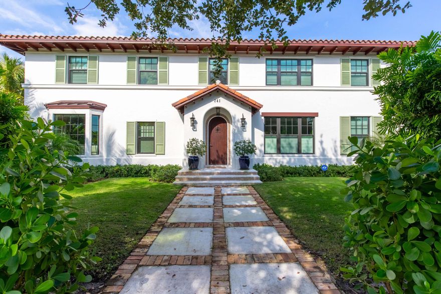 [Closed price reflects furnishings sold separately for $200,000.] This is a rare opportunity to own a new construction home in the highly coveted, historic El Cid neighborhood in West Palm Beach. Completed in 2020, this stunning estate boasts a main house with 4 bedrooms, 4 full and one half baths as well as a separate 2-car garage with second-floor guest quarters. Offered fully furnished, this one-of-a-kind home has been hand curated for a higher standard of living. Keeping the timeless Palm Beach charm and historic architecture, this property has been seamlessly elevated with today's modern, luxurious amenities and comforts. The gorgeous interior offers a main floor with one bedroom and en suite, a formal dining room and a private office, while the second floor features 3 more bedrooms, each with a full bath. Surrounded by lush, impeccably styled landscaping, the outdoor living spaces boast a beautiful covered terrace with a built-in grill, large deck and a heated, saltwater pool. The separate guest suite above the garage offers one bedroom, an en suite full bath and a kitchenette