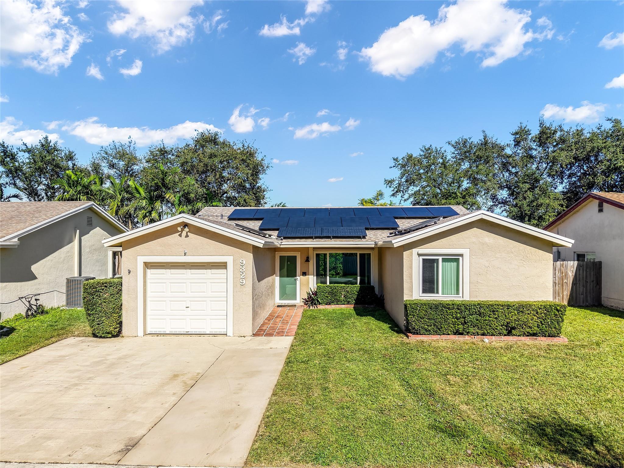 SELLER OFFERING $20,000 CREDIT TOWARDS BUYERS CLOSING COSTS. Buyer may qualify for a 1% lender paid CREDIT with preferred lender. This beautiful home in west Sunrise features 3 spacious bedrooms and 2 renovated bathrooms. Brand new roof and state-of-the-art solar panels installed 2024 ensuring peace of mind for years to come. Full hurricane protection with impact windows and doors (2024) with 20-year transferable warranty to buyer, A/C replaced 2021 with all NEW air ducts installed 2024. Spacious fenced in yard ideal for families and pets. Portable generator fueled by propane tank INCLUDED with sale. Super low monthly HOA! Solar panels are currently leased, buyer to assume solar lease at closing.