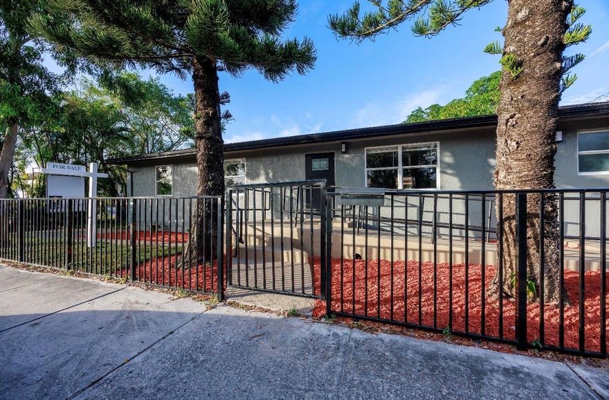 Beautifully and newly remodeled 4-bedroom split-bedroom home on a fully fenced corner lot with outstanding curb appeal. This light-filled residence features a stunning custom white kitchen with sleek white quartz countertops, stainless steel appliances, a huge center island, and recessed lighting throughout. Spacious floor plan includes a large laundry room, generous walk-in closets, and carpeted bedrooms for comfort. Porcelain tile floors enhance the main living areas, while the luxury custom-designed bathrooms showcase high-end finishes and elegant details. Impeccable craftsmanship, stylish upgrades, and thoughtful design make this home truly move-in ready. A must-see property offering beauty, space, and modern living at its finest.