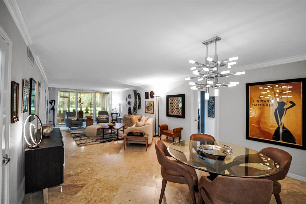 Photo of 933 Cypress Grove Dr #102, Pompano Beach, FL 33069 (MLS # F10541462)