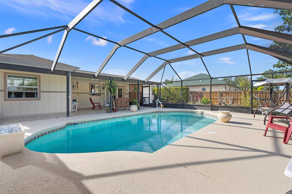No SNOW here only SUNSHINE! Imagine sitting on your oversized lanai overlooking your gorgeous pool and garden views. What would Jimmy say? Pour me another margarita because you are truly in FLORIDA Paradise. Don't worry about blowing out a flip flop cause no shoes needed. You will be the envy of all your Northern friends. They all will now want to visit you! Be careful they may never leave. Look Honey our well appointed kitchen is perfect for entertaining. This home has tons of upgrades and is move in ready. Oh, and did I mention the realtor offers FREE Snow Plowing. Sweetie this is the one we better hurry before our piece o FLORIIDA Paradise is gone. Investors perfect for an Airbnb! Hurry because it won't last.