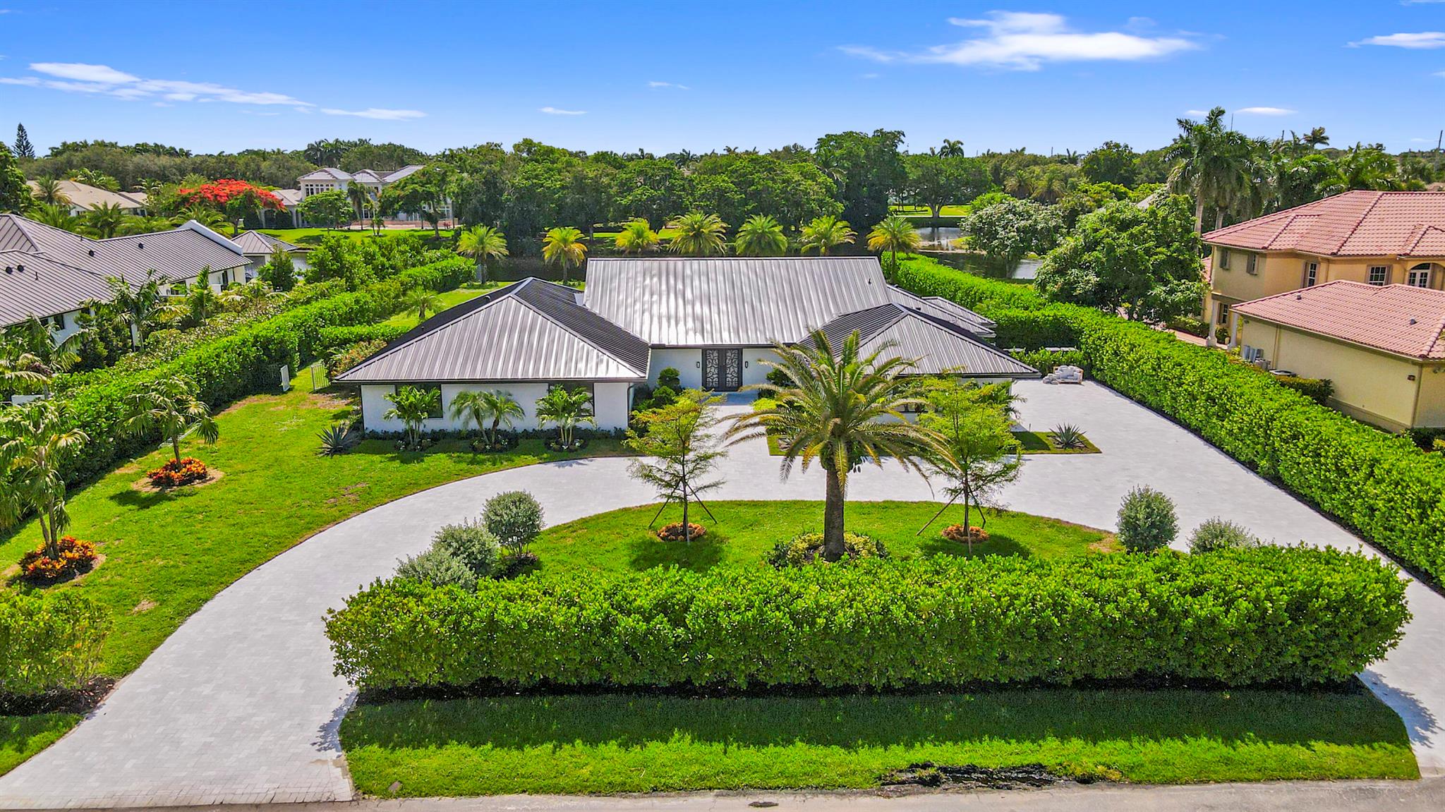 Completely remodeled estate home in highly sought after Fieldbrook Estates. Open floor plan with new, state of the art kitchen, appliances, smart security and lighting systems. Over an acre is perfect for either secluded serene living, family fun, or entertaining. This home features brand new kitchen, appliances, flooring, bathrooms, driveway and patio. The primary suite's spa-like feel enhances comfort and relaxation. The secluded backyard oasis boasts a lap sized pool, island landscape, marble patio and views of a meandering lake.Fieldbrook is a hidden gem in the heart of Boca Raton with low HOA and lot sizes that are too good to pass up. Make this your next dream home!