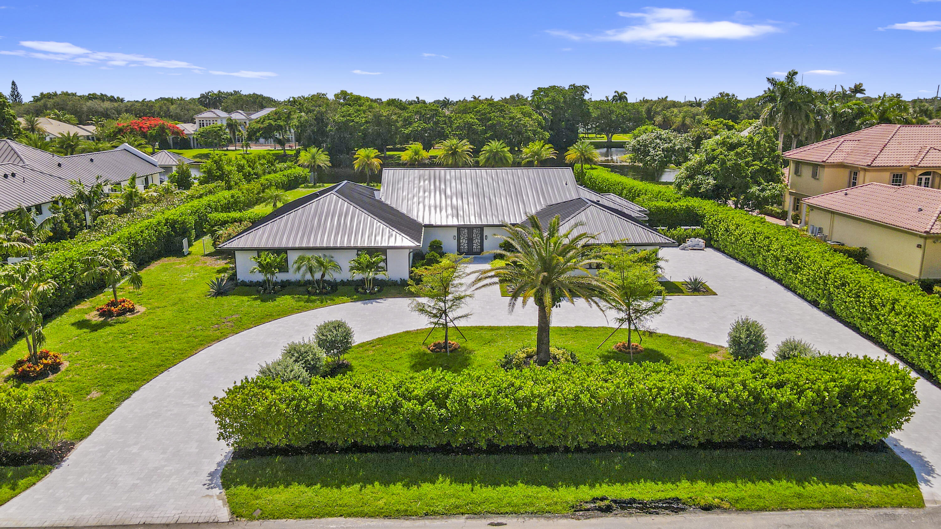 Completely remodeled estate home in highly sought after Fieldbrook Estates. Open floor plan with new, state of the art kitchen, appliances, smart security and lighting systems. Over an acre is perfect for either secluded serene living, family fun, or entertaining. This home features brand new kitchen, appliances, flooring, bathrooms, driveway and patio. The primary suite's spa-like feel enhances comfort and relaxation. The secluded backyard oasis boasts a lap sized pool, island landscape, marble patio and views of a meandering lake.Fieldbrook is a hidden gem in the heart of Boca Raton with low HOA and lot sizes that are too good to pass up. Make this your next dream home!