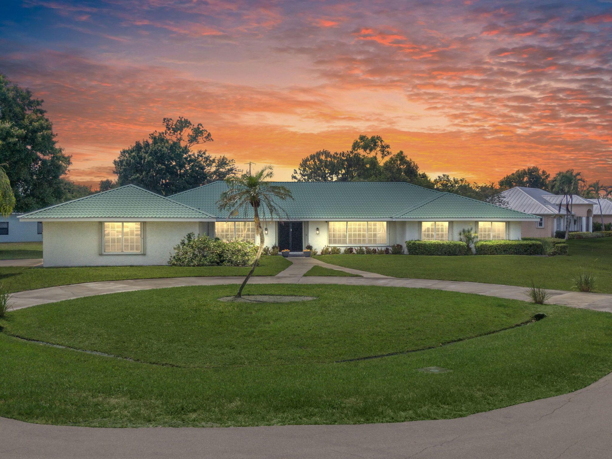 Welcome to 2196 SE Flanders Road, a meticulously maintained estate in the heart of Port Saint Lucie. This expansive 3,660 sq ft single-story ranch style home offers 3 bedrooms, 2.5 bathrooms, and a versatile layout that includes an optional 4th bedroom or office space. Situated on a generous 0.55-acre corner lot, the property boasts a private oversized in-ground pool (8' deep, 20 x 40), making it an ideal retreat for both relaxation and entertaining. Step inside to discover a host of modern upgrades: a brand-new luxury gourmet kitchen, wood plank tile flooring, renovated bathrooms, and updated lighting throughout. Additional features include a 2021 washer and dryer, a 2022 water heater, and two zoned AC units, ensuring year-round comfort.