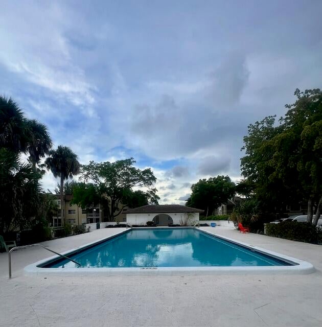Photo of 2700 Riverside Drive #103, Coral Springs, FL 33065 (MLS # B26078330)