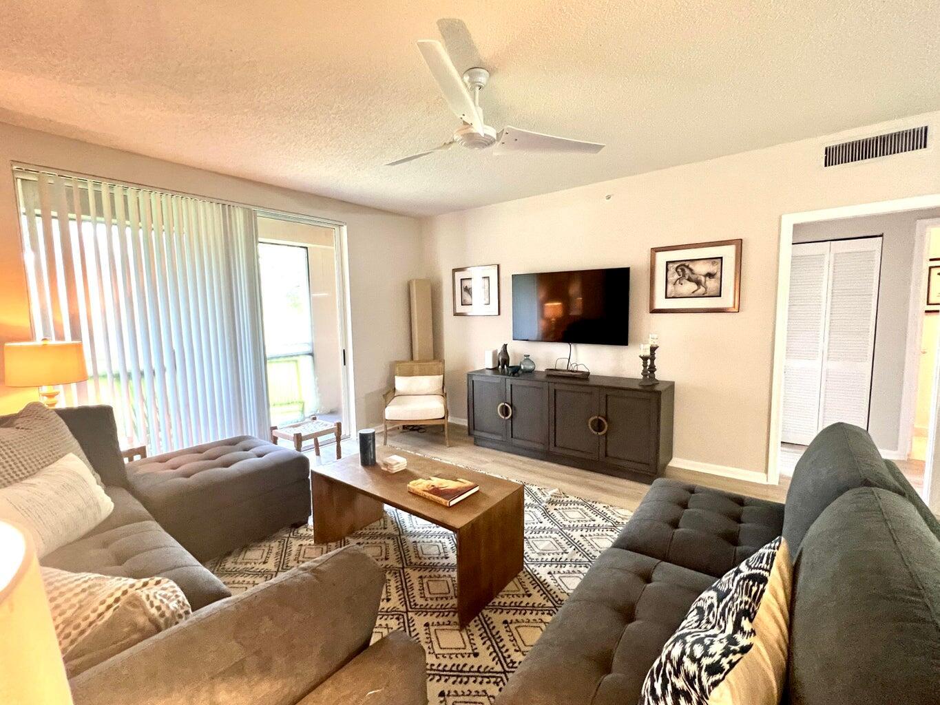 Beautifully renovated 2-bedroom, 2-bathroom residence in the sought-after Saint Andrews at the Polo Club, one of Wellington's premier communities. This exquisite apartment features two spacious en-suite bedrooms, offering privacy and comfort. The remodeled kitchen boasts stainless steel appliances and high-end finishes, seamlessly flowing into the open, sunlit dining and living areas. Enjoy relaxing or entertaining on the covered balcony, perfect for taking in the Florida breeze.This home offers access to exceptional community amenities, including a resort-style pool, fitness center, tennis court, and beautifully maintained groundsSituated close to all major equestrian venues, fine dining, and shopping, this property is perfect as a seasonal retreat or full-time residence.