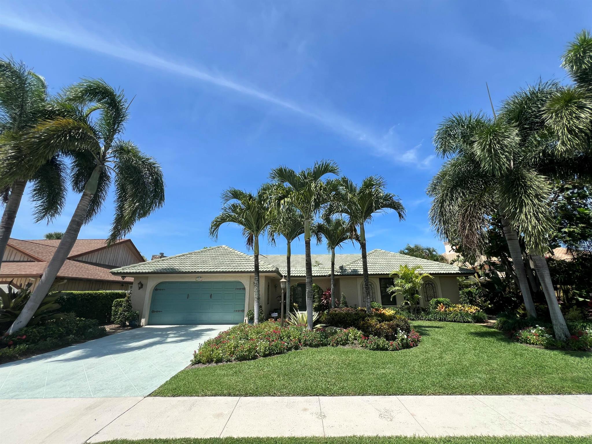 TROPICAL OASIS! Remodeled, One Story, 4/2 with private interior locationand spectacular garden and pool view. The home features a kitchen with generous cabinet storage space, wet bar with pass through to the living room, SS appliances and 42'' custom cabinets with rope crown molding. Tile or vinyl flooring throughout. Home has cement tile roof and CBS Stucco finish. Living room has vaulted ceilings with two skylights. Large bedrooms with ample closet space. One bedroom easilyconverts to a home office or den with double frosted glass door. Master suite has two large walk-in closets w/built-in shelving. Master Bath has a sunken shower an both bathrooms have safety grab bars.