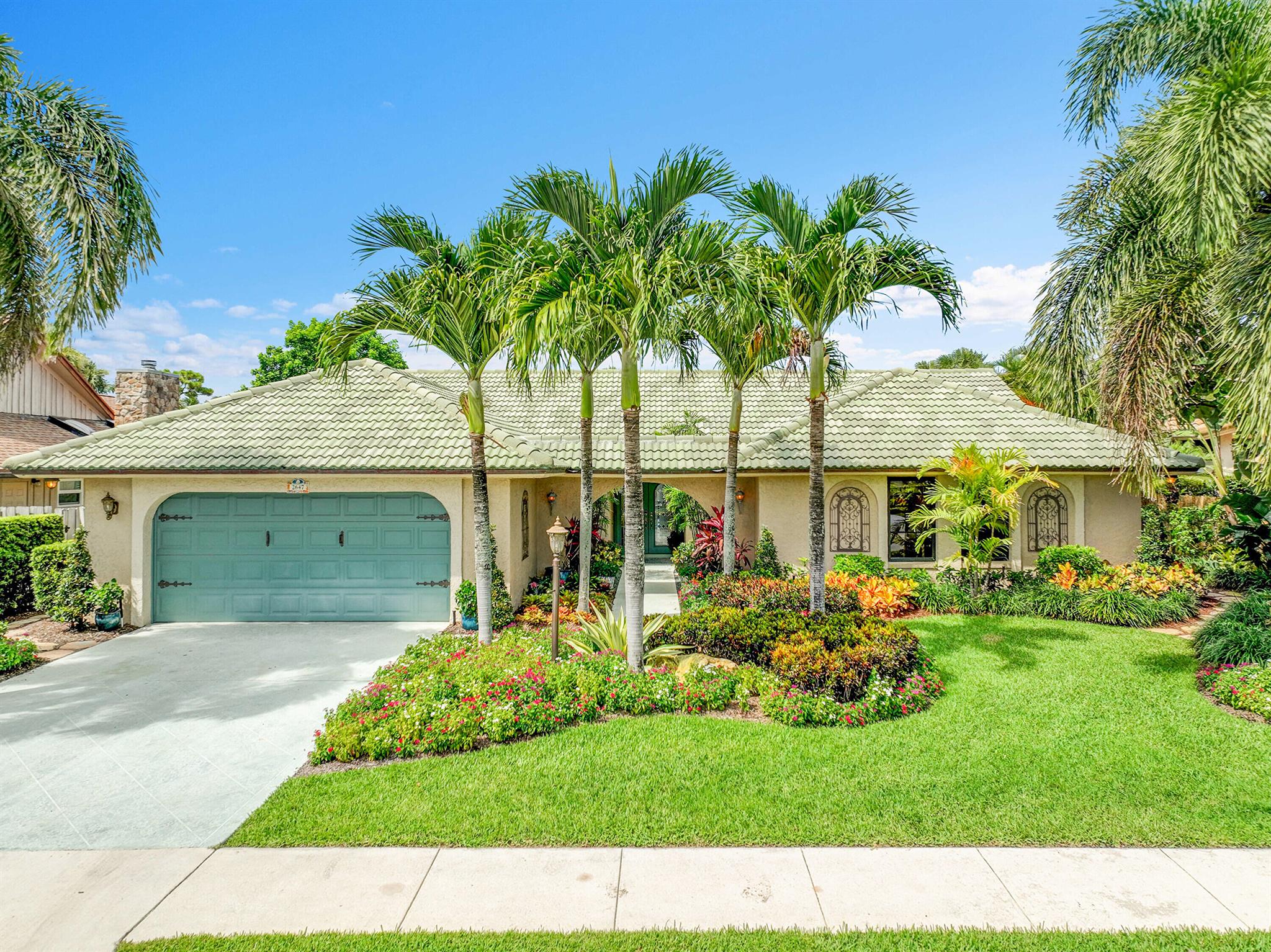 TROPICAL OASIS! Remodeled, One Story, 4/2 with private interior locationand spectacular garden and pool view. The home features a kitchen with generous cabinet storage space, wet bar with pass through to the living room, SS appliances and 42'' custom cabinets with rope crown molding. Tile or vinyl flooring throughout. Home has cement tile roof and CBS Stucco finish. Living room has vaulted ceilings with two skylights. Large bedrooms with ample closet space. One bedroom easilyconverts to a home office or den with double frosted glass door. Master suite has two large walk-in closets w/built-in shelving. Master Bath has a sunken shower an both bathrooms have safety grab bars.