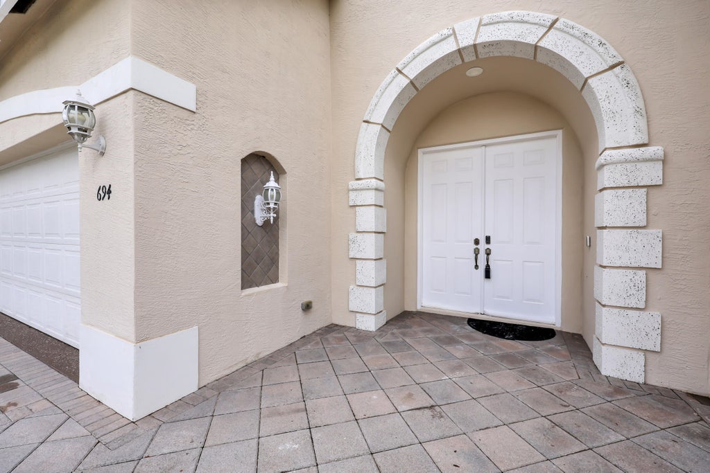 Photo of 694 SW Lake Charles Circle, Port Saint Lucie, FL 34986 (MLS # B26077675)