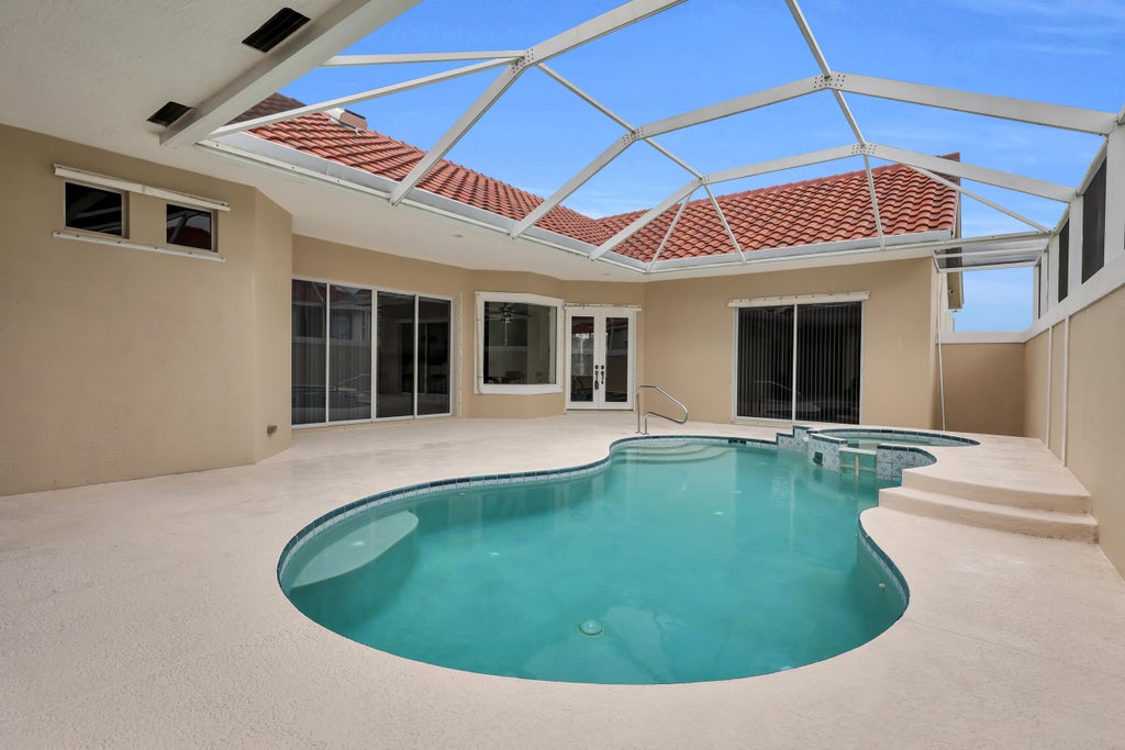 Photo of 694 SW Lake Charles Circle, Port Saint Lucie, FL 34986 (MLS # B26077675)