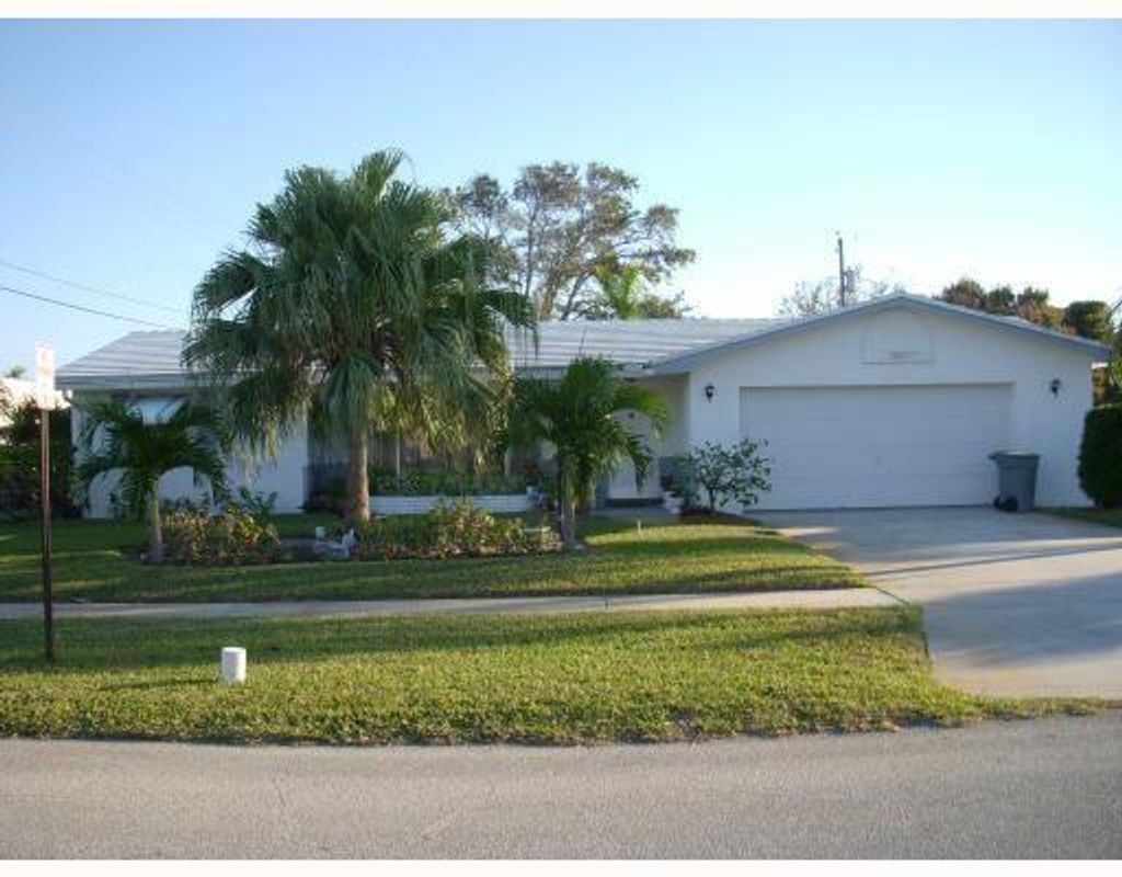 Photo of 118 E Jasmine Drive, Lake Park, FL 33403 (MLS # R10795519)