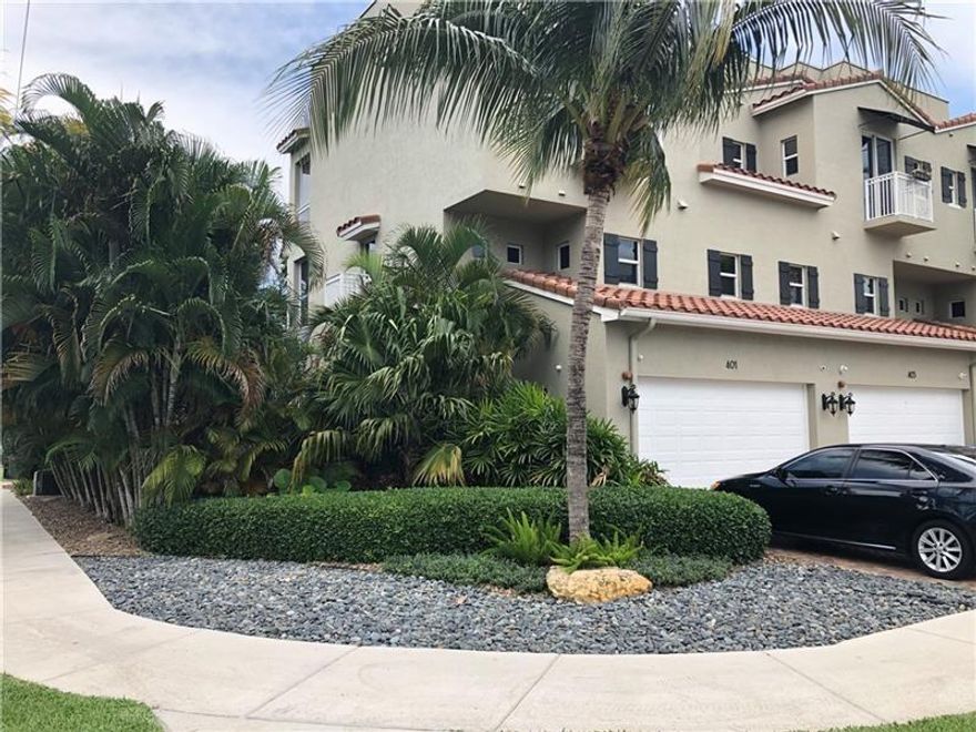STUNNING UPDATED 3-BEDROOM/3-1/2 BATH 3-STORY CORNER UNIT TOWNHOME WITH A HUGE YARD WITH TIKI-HUT FOR ENERTAINING LOCATED JUST MINUTES TO THE BEACH, DOWNTOWN FORT LAUDERDALE AND I-95! THIS HOME OFFERS TILE FLOORING ON THE 1ST AND 2ND FLOOR. BLACK SOLID WOOD FLOORING ON THE STEPS AND 3RD FLOOR! PRE-WIRED FOR SURROUND SOUND IN THE LIVING ROOM, MASTER BEDROOM AND 3rd FLOOR GUESTROOM. GARAGE FLOOR IS TILED FOR THE ULTIMATE MANCAVE