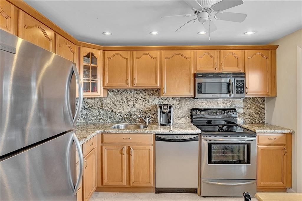 Photo of 2681 S Course Dr #904, Pompano Beach, FL 33069 (MLS # F10361029)