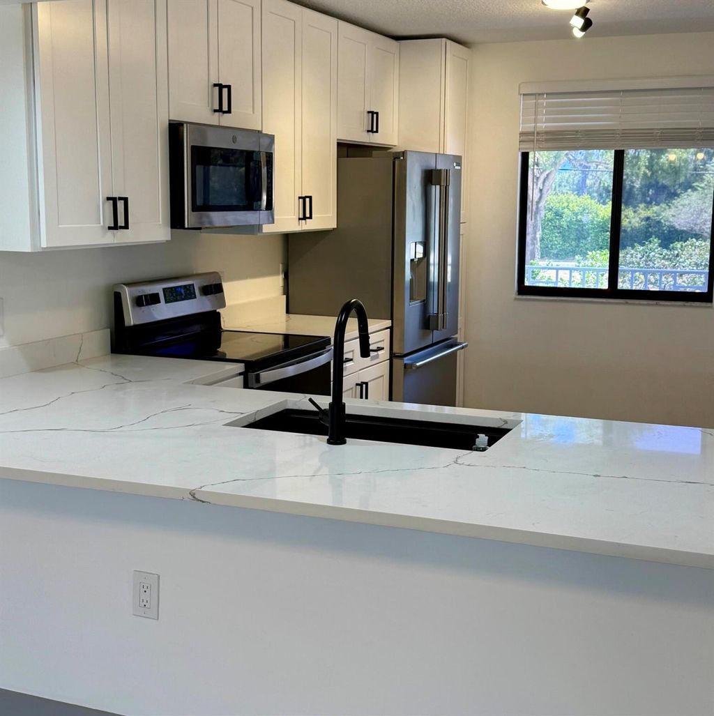 Photo of 2761 Village Boulevard #201, West Palm Beach, FL 33409 (MLS # R11085735)