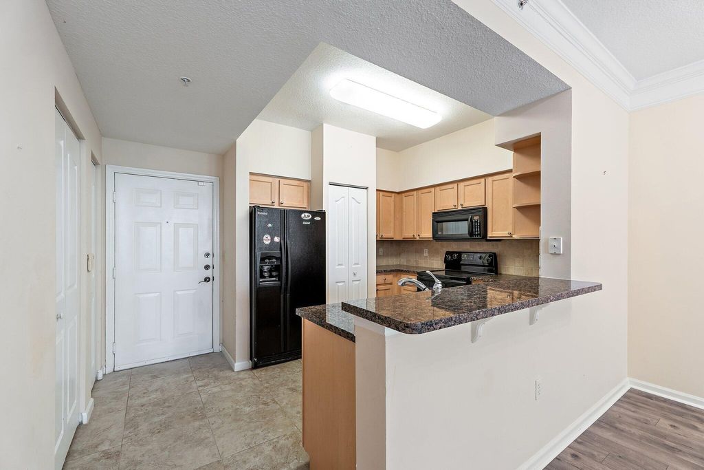 Photo of 275 Murcia Drive #104, Jupiter, FL 33458 (MLS # B26024014)
