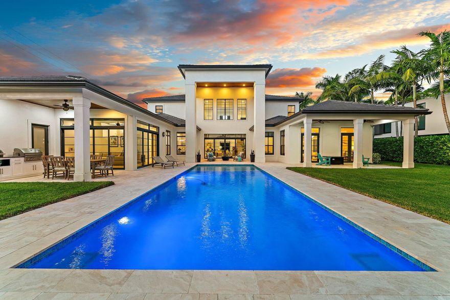 PRIME Pennock Point area... Modern Waterfront Residence with Easy Ocean Access!  This 2017 home offers Superior Quality Construction and coveted South exposure, sited on .75 Acre of wide Riverfront... Private, Secure + Serene.  A grand drive with privacy gates + oversized motorcourt welcomes you.  For car enthusiasts, Garage can accommodate up to 6 CARS!  Exteriors are exquisitely manicured and maintained - better than new!   This home has been finely curated inside + out for the ultimate in Florida luxury living (see upgrade attachment). Entry foyer and living room feature dramatic 28' ceiling w/ double level windows for Tons of natural light.  Custom marble floors and organic built ins create a modern chateau ambiance.  The open kitchen is made for entertaining, offering double islands,  Viking appliances with gas range and a custom butlers pantry. A room sized pantry provides immense storage space. The formal dining room offers comfort + elegance and a nearby breakfast nook showcases water + nature views. Additional main floor rooms include a cozy Florida style family room, great for quiet enjoyment or movie + sports watching.  Also, a spacious office + separate fitness room offer fantastic indoor space.  An extravagant Owners Suite on the main floor offers luxury, privacy and a true haven for relaxation. The upper level features 3 spacious bedrooms, all with ensuite baths + enviable closets. This impeccable residence blends comfort with luxury inside + out. Set on 3/4 acres of a fully fenced + landscaped tropical retreat, the outdoor area is designed to impress, elevating the Florida lifestyle:  Enjoy al fresco dining from a dream summer kitchen, sunning + swimming in the oversized pool, boating off of the new (Jan 2026) dock or just walking the verdant grounds and watching the sunsets.  This coveted Jupiter location is just South of Jupiter's famed Pennock Point and offers some of the finest boating and living options in all of North County!   A beautiful lifestyle awaits you in the heart of Jupiter...