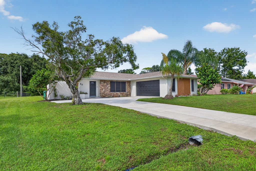 Photo of 1425 SE Minorca Avenue, Port Saint Lucie, FL 34952 (MLS # B26074899)