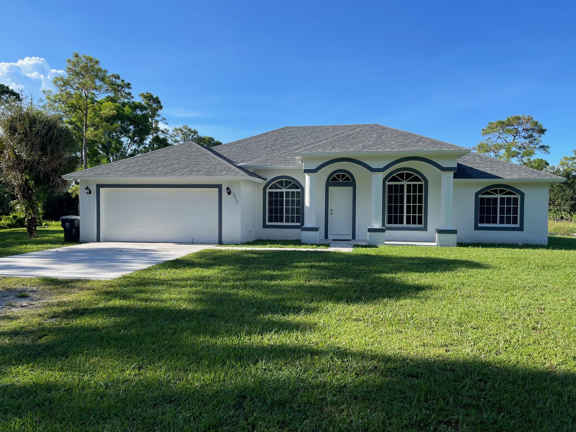 QUICK MOVE IN! IMMACULATE 4 BEDROOM/2 BATH ON AN 1.25 ACRES-NEW A/C & WATER HEATER-NEW ROOF-CONVENIENTLY LOCATED CLOSE TO WESTLAKE AND IBIS SHOPPING CENTERS