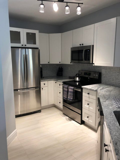 Photo of 800 Uno Lago Drive #204, Juno Beach, FL 33408 (MLS # B26071200)