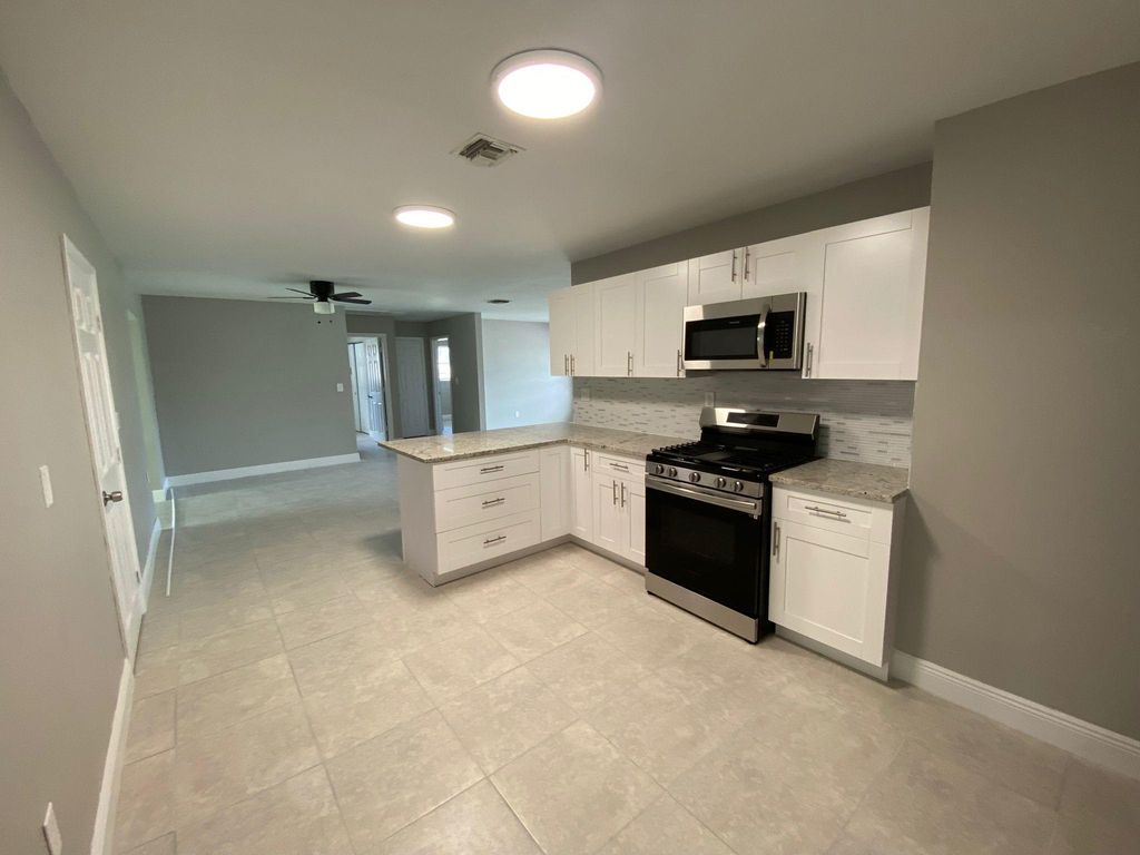 Photo of 9121 Bamboo Drive, Palm Beach Gardens, FL 33410 (MLS # B26050571)