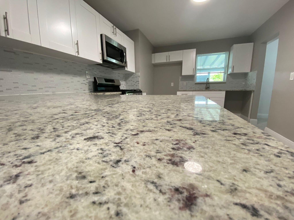 Photo of 9121 Bamboo Drive, Palm Beach Gardens, FL 33410 (MLS # B26050571)