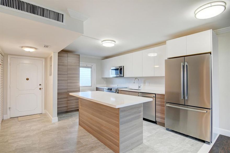 REDUCED TO SELL. FULLY RENOVATED beautiful unit with BRAND NEW BOSCH appliances, WASHER/DRYER never used. MUST SEE East Boca condo, spectacular views/location. All work completed with permits/approval and inspections. Beautiful 2/2 unit with living room den wall removed for MORE SPACE. Newer AC unit, water heater. BOSCH appliances have 5 YEAR WARRANTY, never used. WOOD floors and TILE throughout. Bathrooms completely redone with 2 walk in TILED showers. Beautiful cabinets and matching quartz counter tops. MOVE IN READY condo in East Boca Raton with A RATED SCHOOLS, perfect for vacation property or investment due to proximity to FAU & future home to Boca National Golf Club, to which the screened balcony overlooks. Amazing views from all sides. HOA covers: Cable TV, Internet, Water, Trash. Country Club life, without the expensive country club membership/equity buy-in!!!