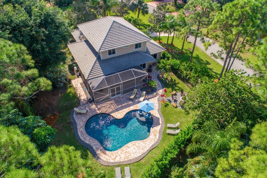 RIVER LANDING PALM CITY POOL HOME!! This home is located in A rated school district and sits on a large corner lot with a huge circular driveway! SOLID CONCRETE BLOCK CONSTRUCTION with an incredible pool area that any family will love! The backyard has a large screened Lanai for protected sun bathing that leads to an open pool are and FIRE PIT! Mature lush landscaping surround the property as well as a fence around the whole backyard perimeter! Also located on a Quiet Culdesac for perfect lot location! The interior of the home has 4 full bedroom and 3 full baths. The kitchen includes Granite Counters as well as Stainless Steel Appliances! River Landing is a ''GATED'' community with very low monthly fees and the amenities include a boat storage lot (waiting list) + BOAT RAMP , Tennis court, Playground for the kiddos! This is one of the BEST PALM CITY communities with tons of character and charm. Don't miss your opportunity!