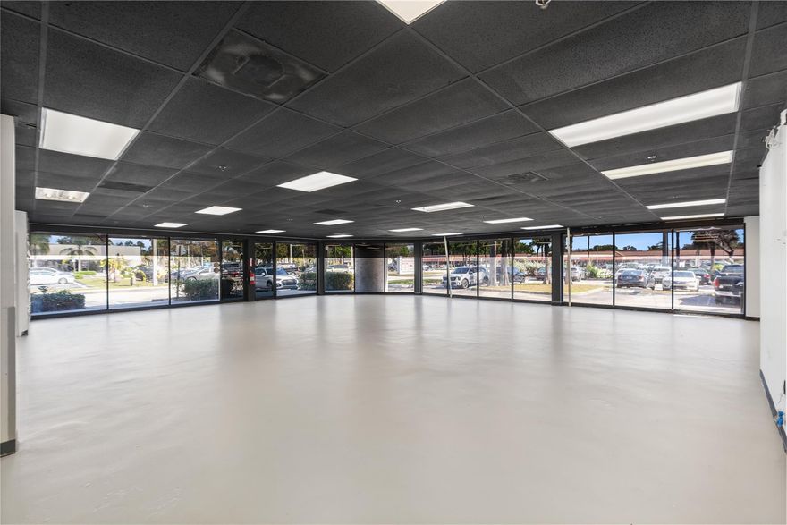 **NOW AVAILABLE** Prime corner retail space offering outstanding street visibility and exposure along a high-traffic corridor with nationally recognized tenants. The unit has been fully revamped with freshly coated flooring, and a repainted ceiling creating a modern, move-in-ready space for the next tenant. Featuring ample parking, prominent corner frontage on University Drive, and immediate adjacency to 529 newly constructed luxury residential units, this location is ideal for retail, medical, or professional office users seeking strong visibility, accessibility, and built-in foot traffic.
